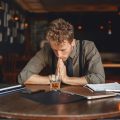 Wellbrook Recovery shows a businessman in a bar to demonstrate the struggles of the functioning alcoholic