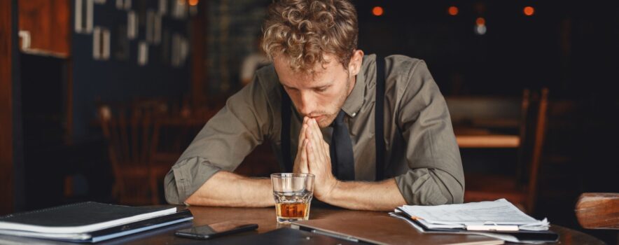Wellbrook Recovery shows a businessman in a bar to demonstrate the struggles of the functioning alcoholic