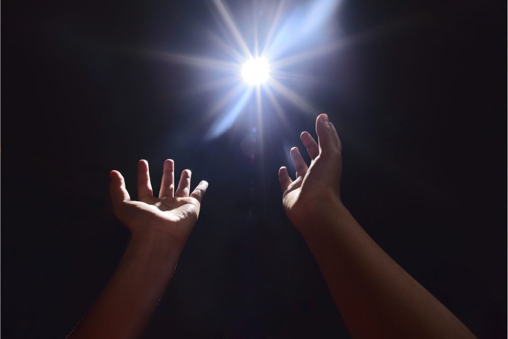 Wellbrook Recovery shows hands reaching to a light source to explain the stages of addiction