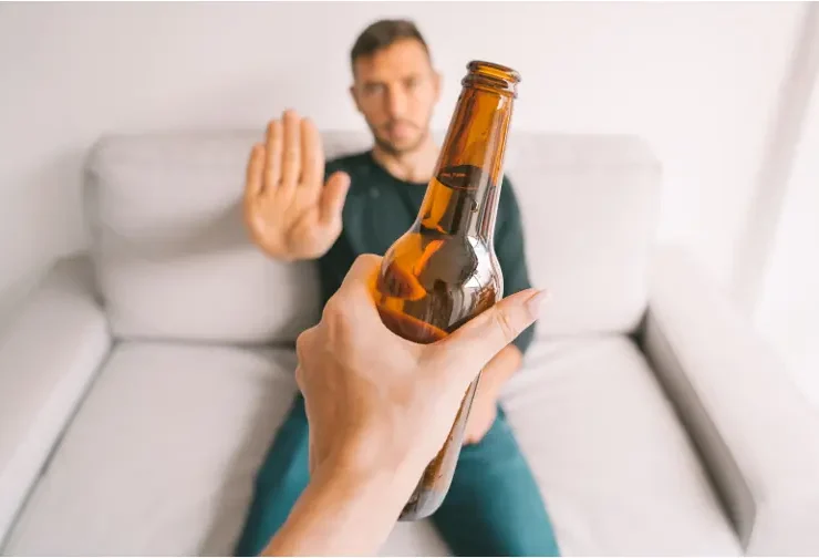 man saying no to alcohol and other addictions
