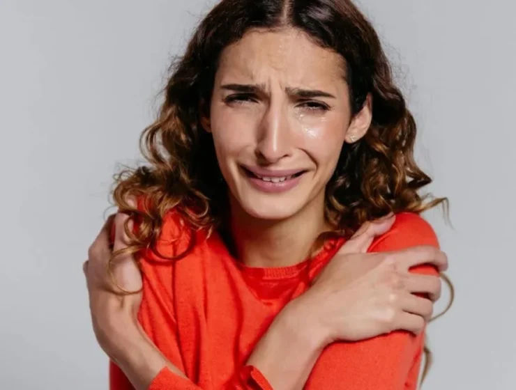 Woman in distress: emotional challenges can be addressed through DBT for addiction.