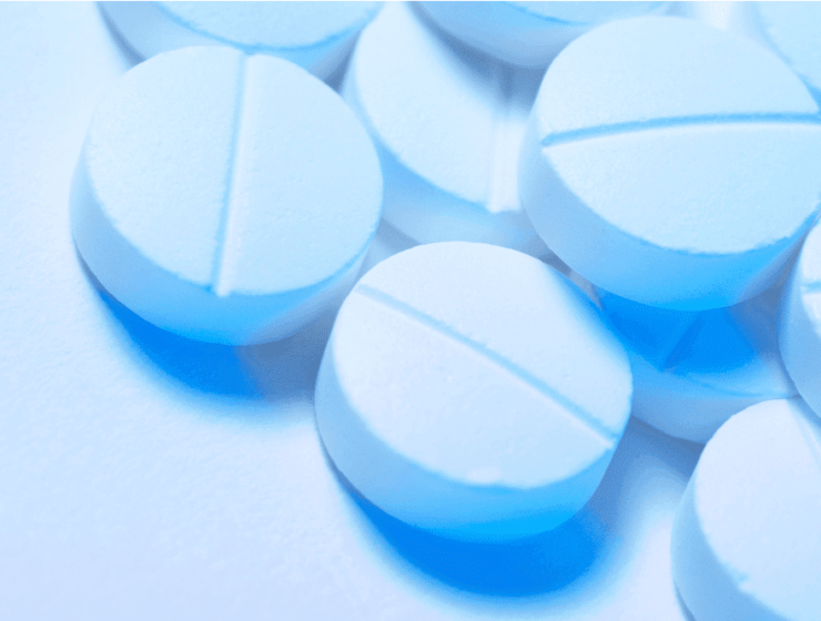 A cluster of blue Adderall pills, used to improve focus. Learn how to manage Adderall withdrawal.