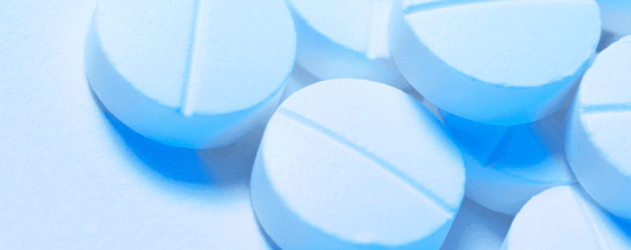 A cluster of blue Adderall pills, used to improve focus. Learn how to manage Adderall withdrawal.