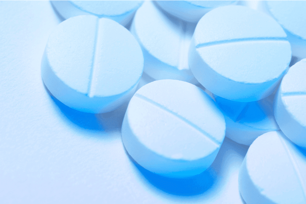 A cluster of blue Adderall pills, used to improve focus. Learn how to manage Adderall withdrawal.