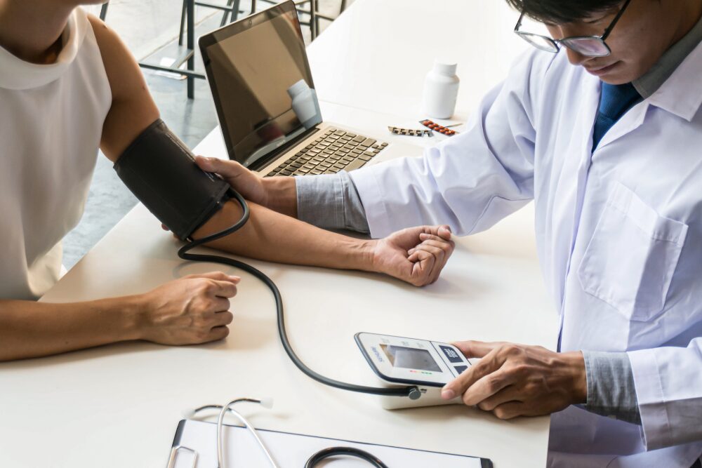 Doctor monitors patient's vitals, highlighting the importance of medical detox for safe, supervised substance withdrawal management.