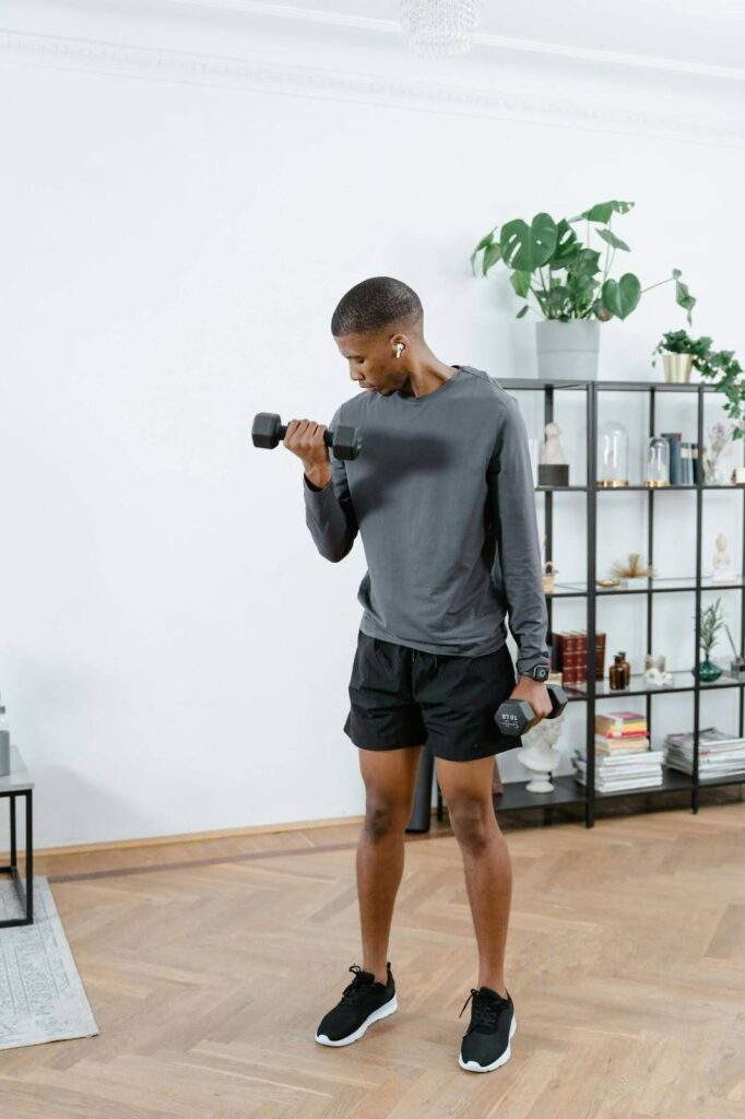 Man lifting weights to help manage Marijuana withdrawal symptoms and support recovery.