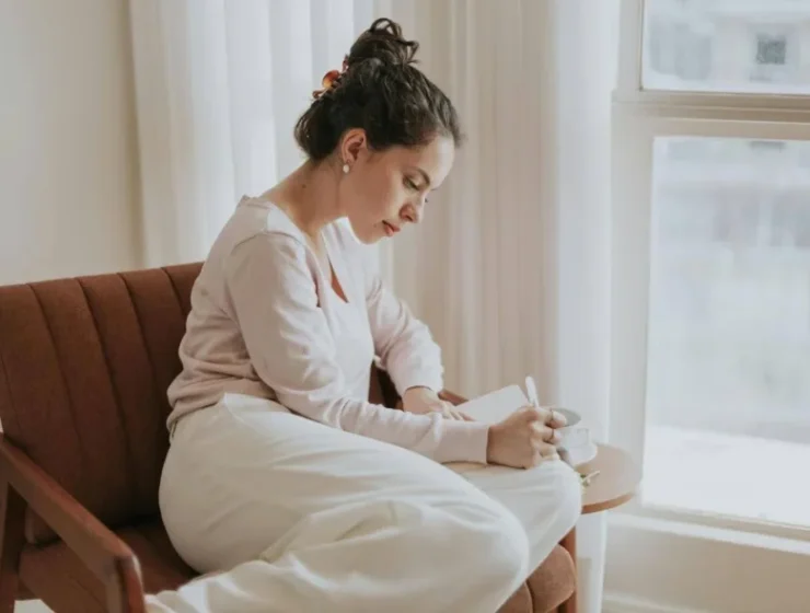 Woman practicing mindfulness in addiction recovery through intentional pause and reflection.