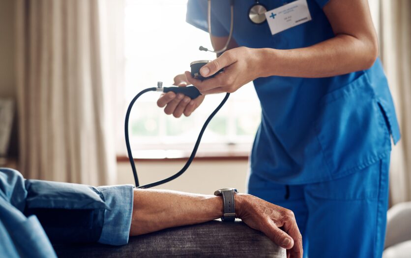 Nurse monitoring patient’s vitals during supervised medical detox, ensuring safe administration of detox medications