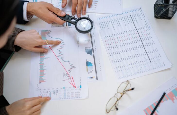 Researchers reviewing statistical charts, finding that detox medications in supervised medical detox programs are highly effective