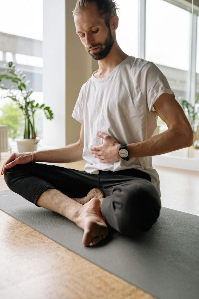 A man practicing mindful breathing during acceptance and commitment therapy for addiction.