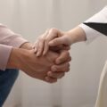 holding patients hand