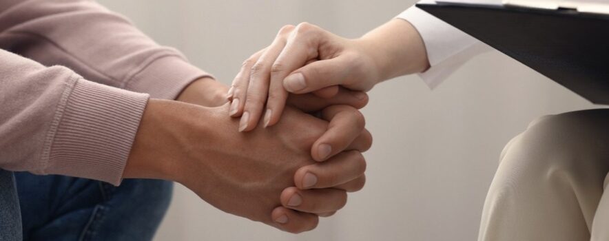 holding patients hand