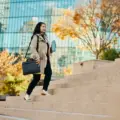 businesswoman-walking-up-city-steps