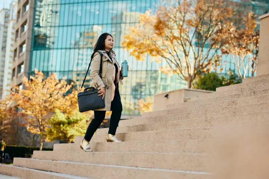 businesswoman-walking-up-city-steps