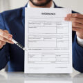 Insurance, signature and documents with hands of lawyer for offer, contract and review. Advisor, at.